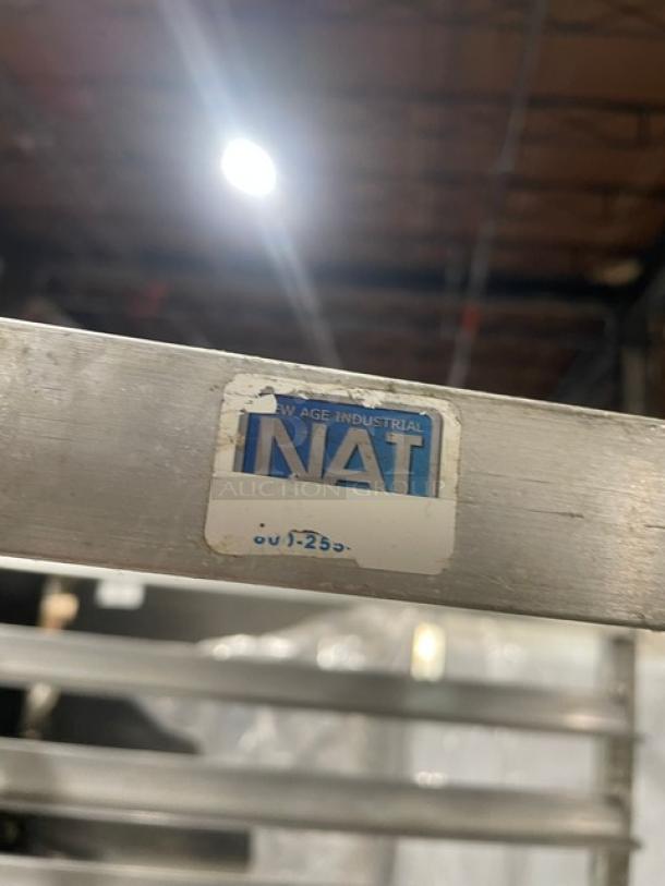 Commercial aluminum full-size heavy duty bun/sheet pan rack with casters, labeled "New Age Industrial."