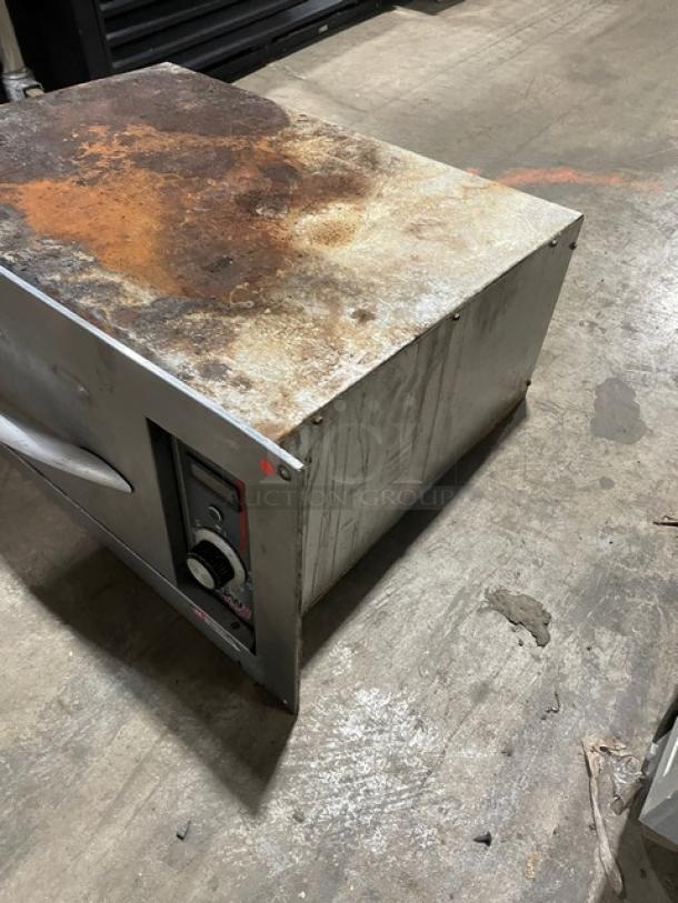 APW Wyott HDDi-1 stainless steel warming drawer, thermostatic controls, visible rust and wear, model HDDi1208BS, 208V, 1 phase.