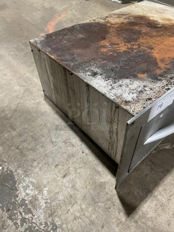 APW Wyott HDDi Series stainless steel warming drawer, model HDDi1208BS. Features thermostatic controls, visible wear and rust. Serial SN: 817811402001, 208V, 1 phase.