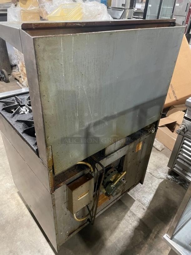 US Range commercial stainless steel 2-burner split-top flat griddle range/oven combo with back splash, overhead salamander shelf, and casters.