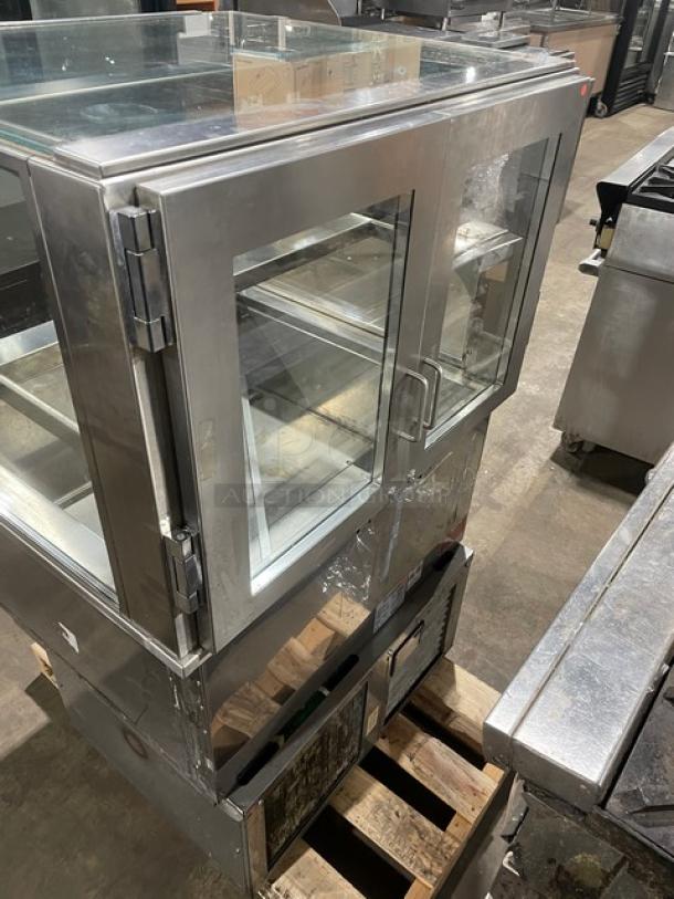 RPI Industries Vienna Series refrigerated display case, stainless steel, model VIAS220RSQSC, rear swinging glass doors, SN: 12107223.