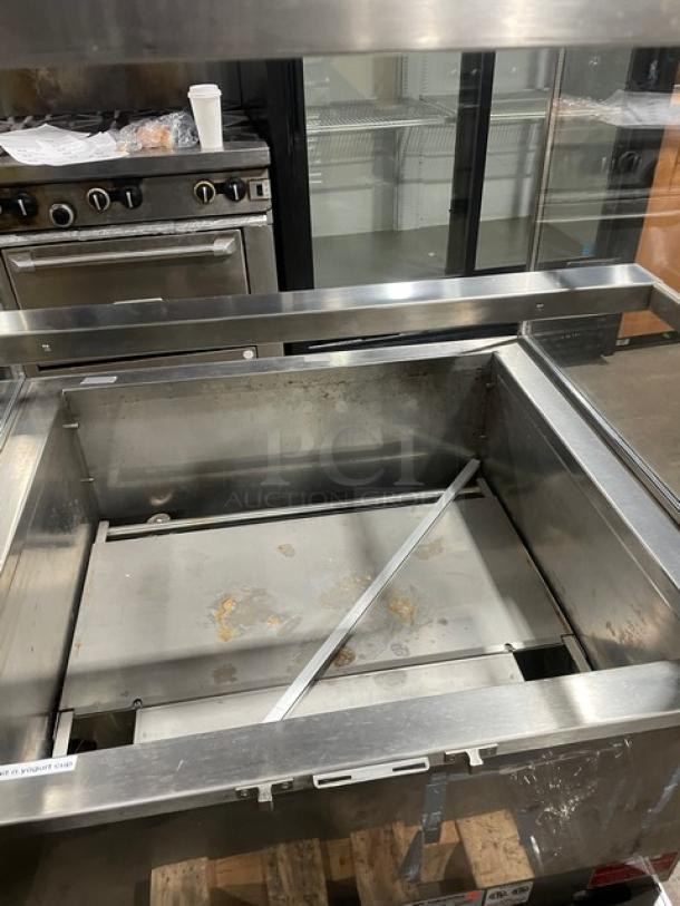RPI Industries Vienna Series stainless steel grab-n-go merchandiser, Model VIAS220RSQSC, with rear glass doors, visible wear.
