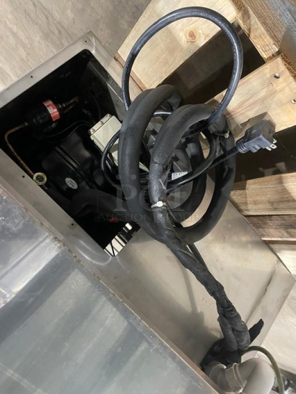 RPI Industries Vienna Series refrigerated merchandiser compressor unit close-up, showing wiring and components. Model VIAS220RSQSC.