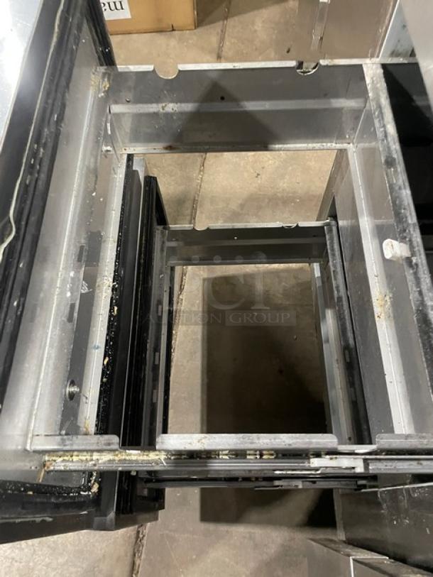 Hoshizaki stainless steel 4-drawer refrigerated prep table with visible wear. Perfect for salads/sandwiches. Mega top style.