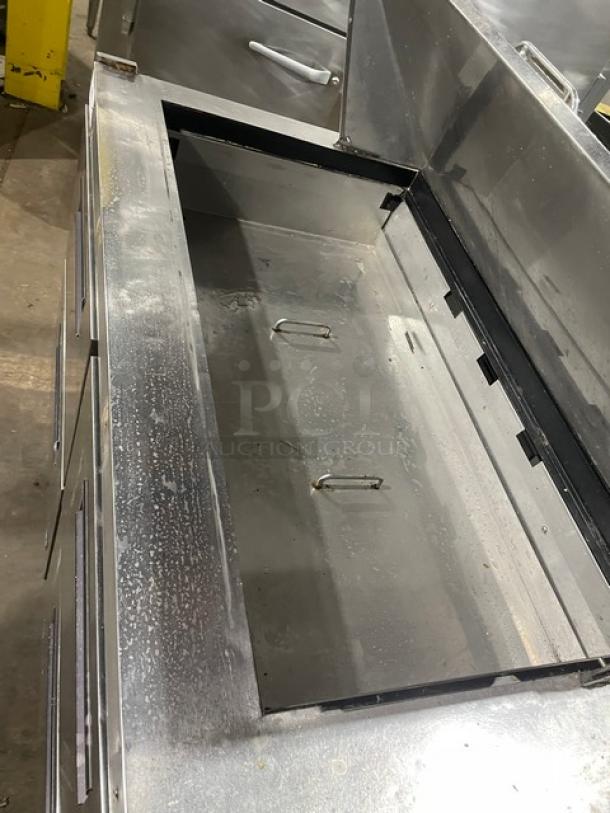 Hoshizaki stainless steel 4-drawer refrigerated prep table, Bain Marie style, for salads/sandwiches, visible wear, spacious top.