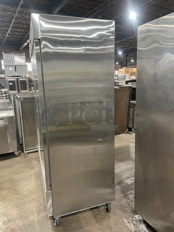 Asber commercial stainless steel 2-door reach-in refrigerator, model APR49HF, on casters, includes poly-coated wire rack.