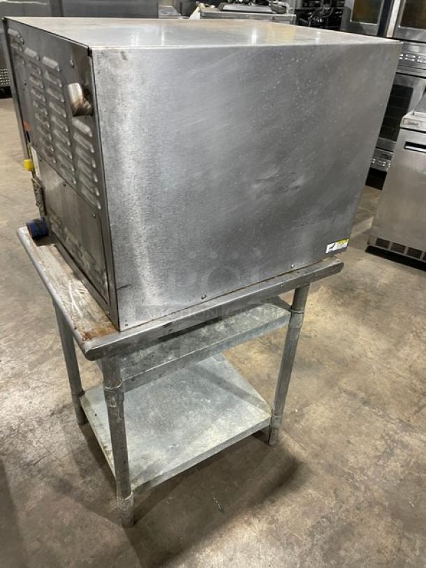 Groen Smart Steam 100 Series SSB3E stainless steel electric convection steamer on dual section stand with built-in pan rack.