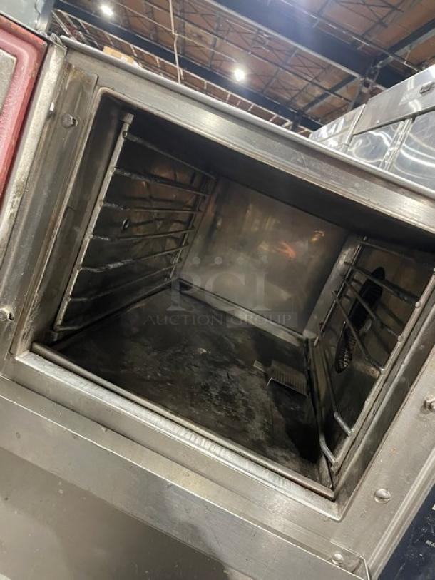 Groen Smart Steam 100 Series commercial stainless steel electric convection steamer, model SSB-3E, with pan rack, on dual-section equipment stand.