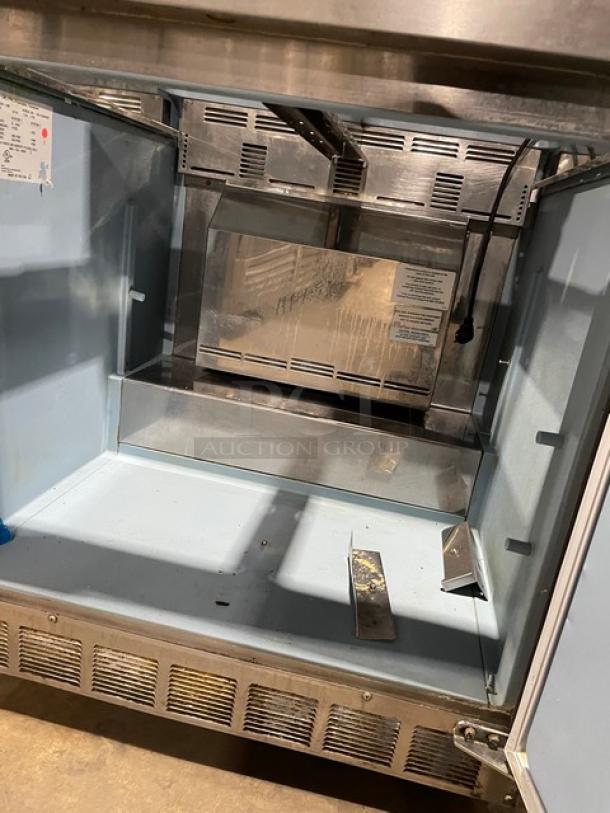 Delfield stainless steel prep table, Model 4432N12M, with one-door refrigerated base, casters, and interior view.