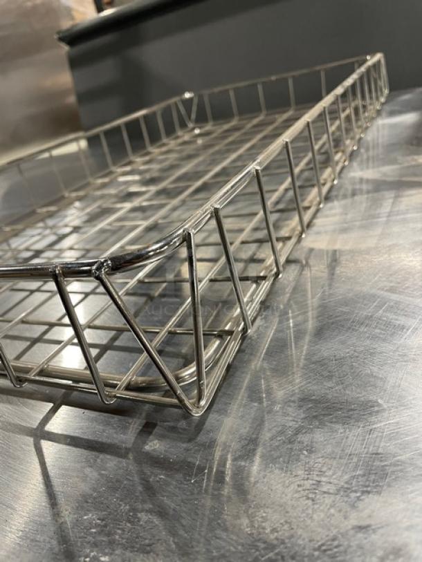 Commercial chrome-plated wired rack for bagels/pastries, full-size. Excellent condition, durable design for efficient display.