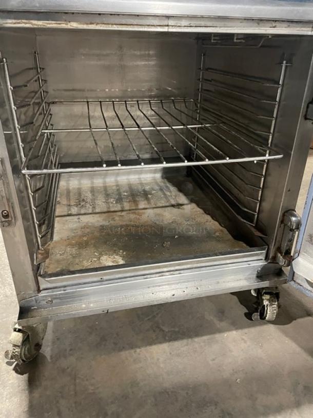 Alto-Shaam 750-TH/II commercial low-temp cook and hold oven, stainless steel, model 2017, on casters, wired rack.