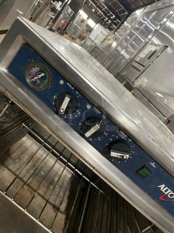 Alto-Shaam Model 750-TH/II 2017 stainless steel low-temperature cook & hold oven, features individual controls, wired rack, and casters.