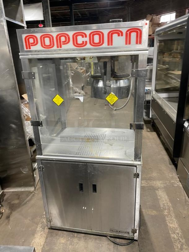 Gold Medal Model 2010TM stainless steel popcorn popper, commercial grade, with heated corn deck, front "POPCORN" signage.