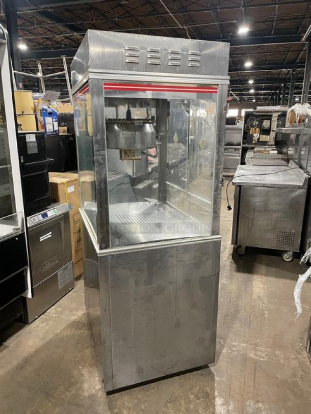 Gold Medal 2010TM popcorn popper, stainless steel, electric, cabinet style, heated corn deck, commercial use.