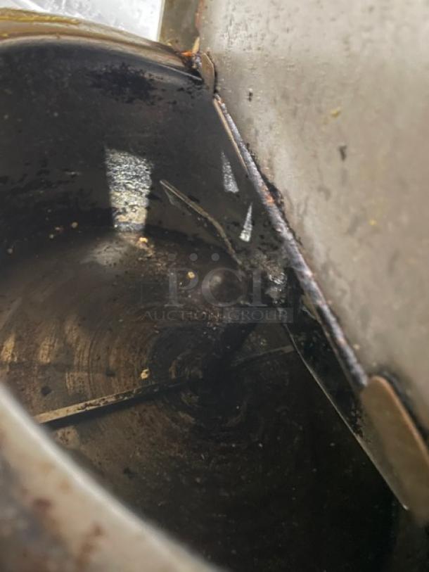 Gold Medal 2010TM popcorn machine interior, showing signs of use and wear, model SN: NSTM-00449A, stainless steel.