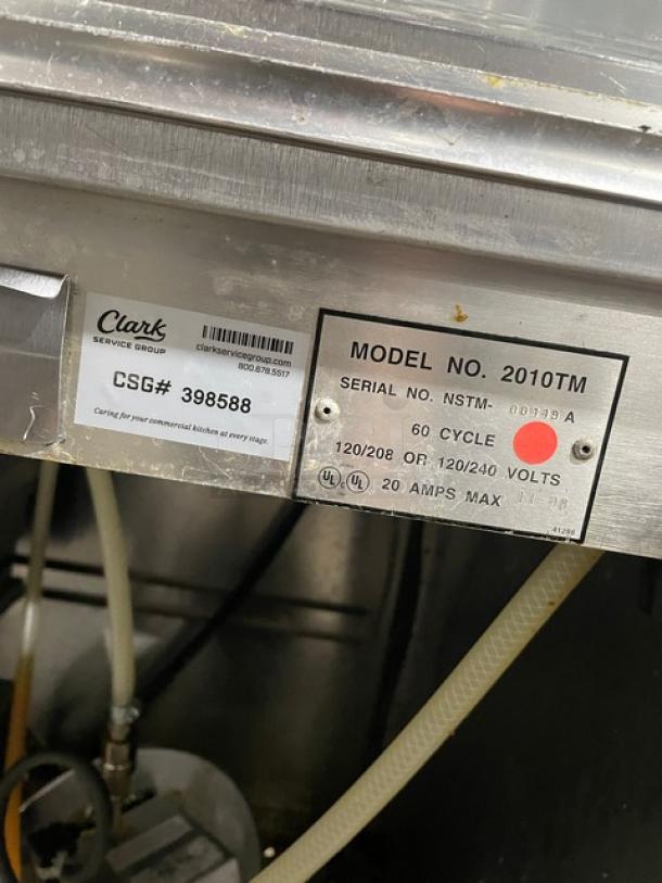 Gold Medal 2010TM popcorn popper, commercial stainless steel, heated corn deck, 120/240V, model and serial tags visible.