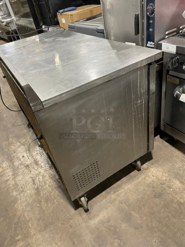 True TWT-60 stainless steel 2-door worktop refrigerator. Energy Star certified, on casters, with poly-coated rack.