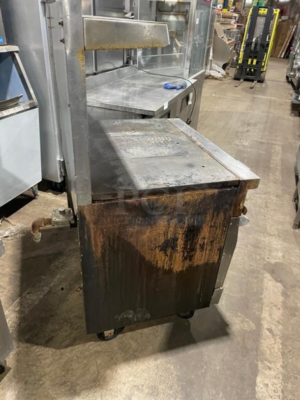 Vulcan 36L commercial stainless steel French top range/oven combo on casters, natural gas, visible wear and rust.