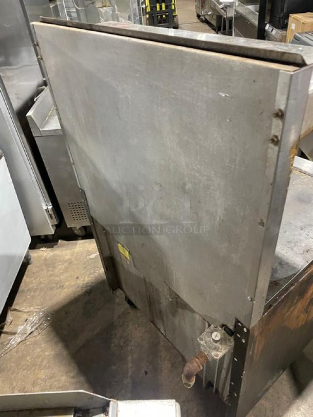 Vulcan 36L stainless steel French top range/oven combo, natural gas, on casters, visible wear, SN: A8112971OUT.