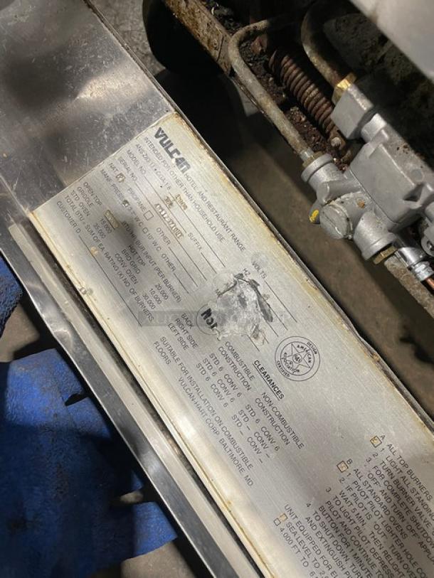 Vulcan 36L Commercial Stainless Steel Gas French Top Range/Oven, on casters, features label and model details visible.