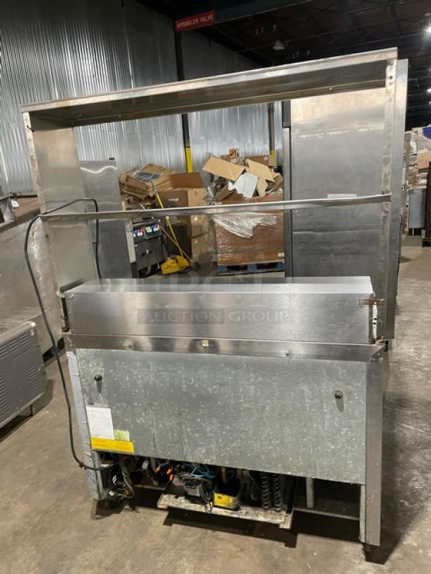 Asber APTS4812 stainless steel 2-door refrigerated prep table with dual overhead storage shelf, on casters, model SN: 8102279534.