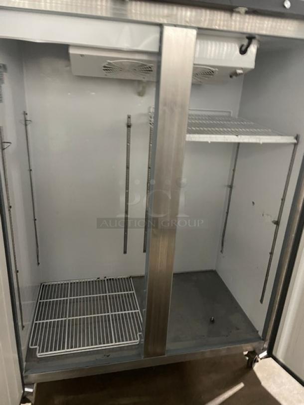 Maxx Cold MXCF-49FD commercial stainless steel 2-door reach-in freezer with poly-coated wire racks on casters, 115V.