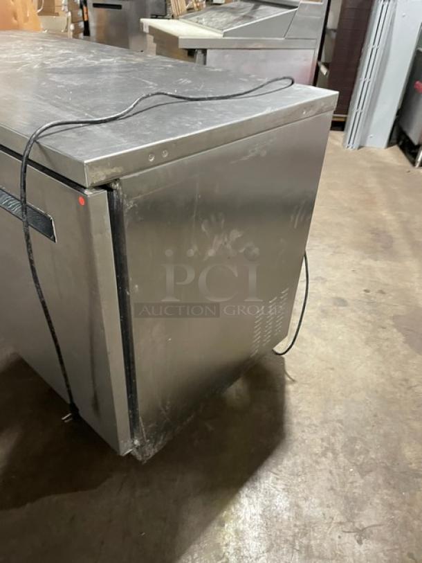 Arctic Air AUC60RZ stainless steel 2-door lowboy cooler on casters. Includes poly-coated wired rack. Model: AUC60RZ, SN: H22055130.