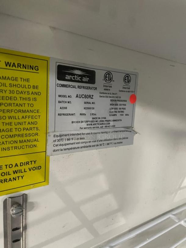 Arctic Air AUC60RZ commercial 2-door stainless steel lowboy cooler, poly-coated rack, SN: H22055130, 115V, on casters.