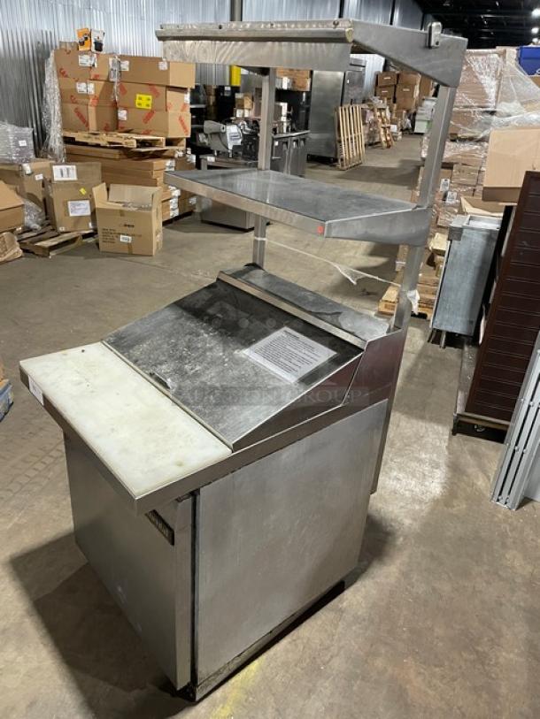 Continental stainless steel prep table, model DW27-12M, with refrigerated base, cutting board, and dual-section shelf.