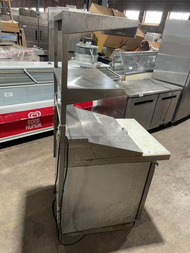 Continental Bain Marie style stainless steel prep table, model DW27-12M, with refrigerated base, cutting board, dual section overhead shelf, and poly coated wired rack. 115V, 1 phase.