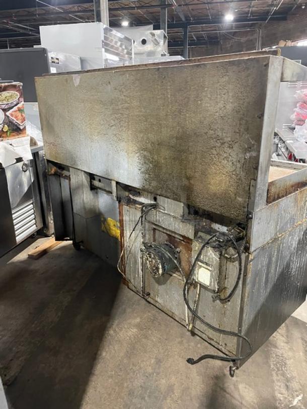 Garland H280 Series stainless steel natural gas griddle range with double oven, back and side splash, overhead salamander shelf, model H289RC72GTH, on casters.