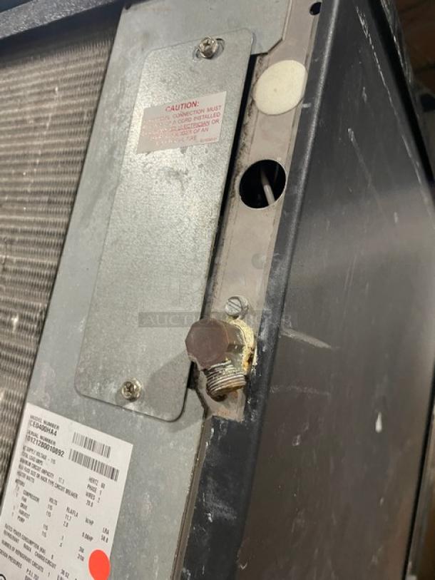 Ice-O-Matic ICE0400HA4 commercial ice maker, stainless steel, air-cooled, 115V, 1 Phase, on legs. Visible caution label and serial number tag.