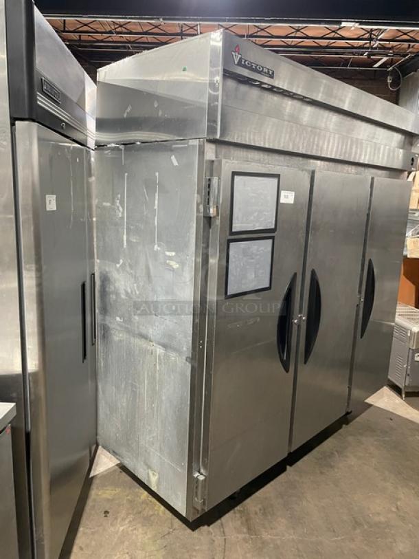 Victory commercial stainless steel 3-door reach-in freezer with poly coated wired rack, on casters. Signs of wear.