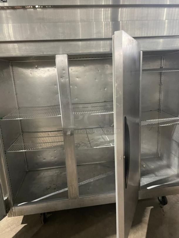 Victory commercial stainless steel 3-door reach-in freezer with poly coated wire rack, on casters, excellent condition.