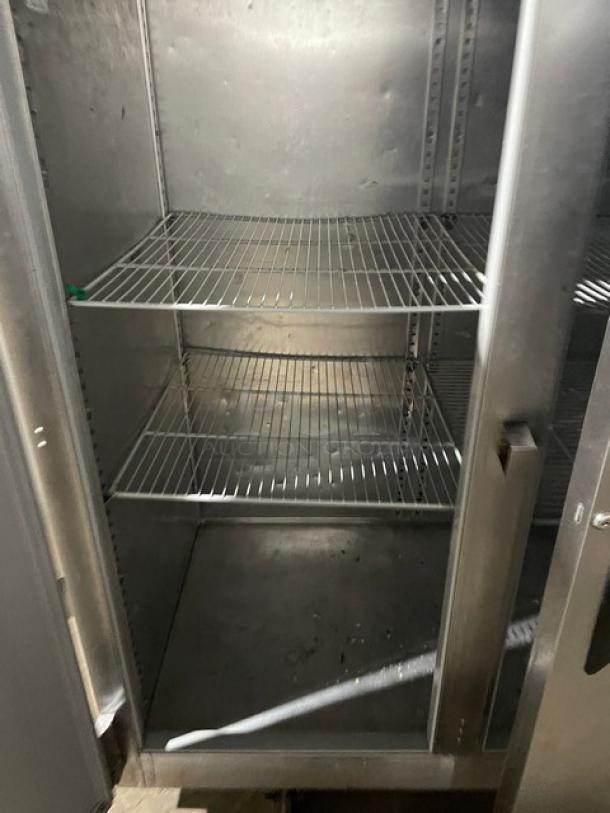 Victory 3-door stainless steel reach-in freezer with poly-coated wire rack, mounted on casters. Clean interior, excellent condition.
