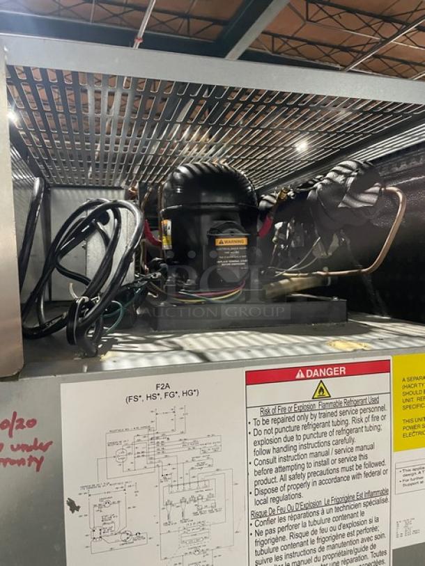 Hoshizaki Model F2AFS reach-in freezer components, warning labels, wiring, and instructions visible.