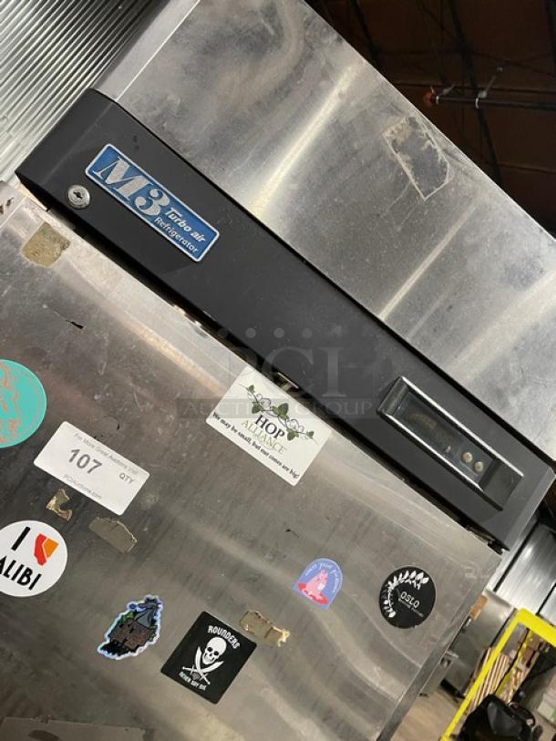 Turbo Air M3 Series stainless steel half-door refrigerator, Model M3R24-2, with stickers and control panel, on casters.