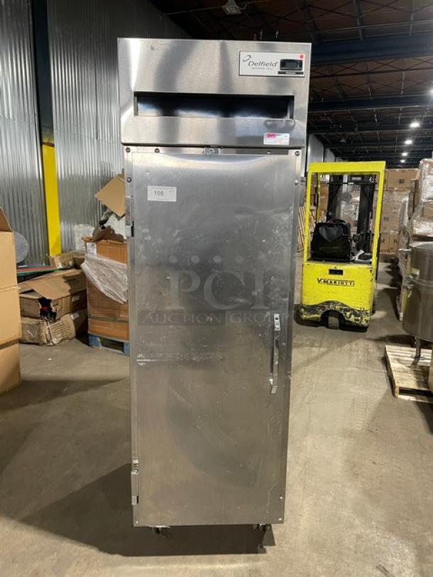 Delfield 6000-XL Series stainless steel single door reach-in freezer, poly-coated rack, on casters, model label visible.