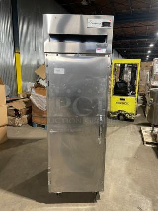 Delfield 6000-XL Series stainless steel single door reach-in freezer, poly-coated rack, on casters, model label visible.