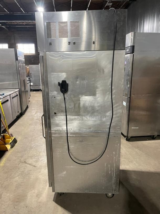 Delfield 6000-XL stainless steel reach-in freezer, solid single door, poly coated rack, on casters; visible power cord.