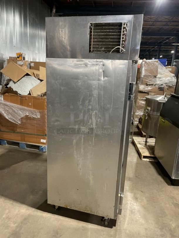 Delfield 6000-XL Series stainless steel reach-in freezer, solid single door, with poly coated wired rack, on casters, used condition.