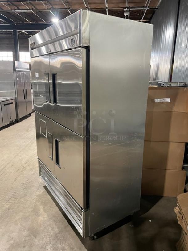 True T-49F-4 stainless steel double section reach-in freezer with half doors, poly coated rack, on casters, excellent condition.