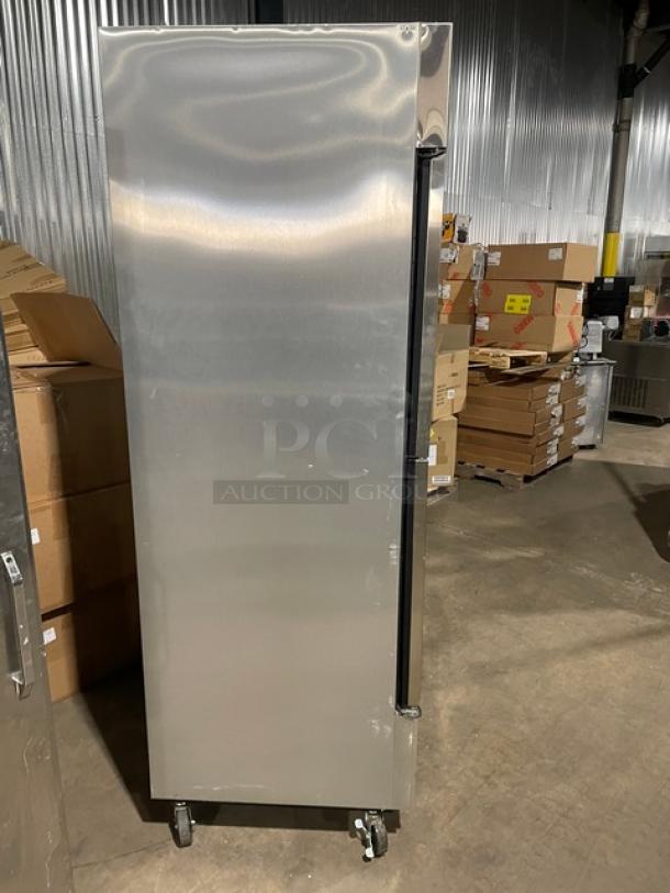 True T-49F-4 stainless steel half-door reach-in freezer, on casters, with poly-coated wire rack, model T49F4, 115V, used.
