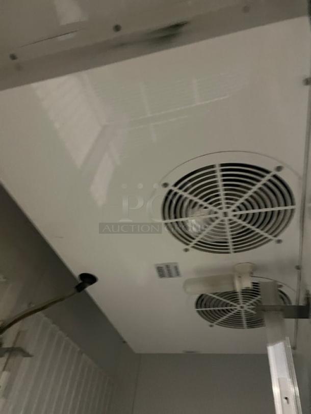 True T-49F-4 freezer interior, ceiling fan vents, stainless steel, poly-coated wire rack visible, commercial grade.