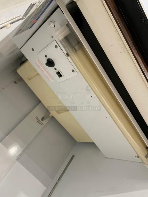 Beverage-Air MT27 commercial refrigerator interior view, showing poly-coated wired rack and control panel. Model MT27, SN: 3215140, 115V, 1 phase.