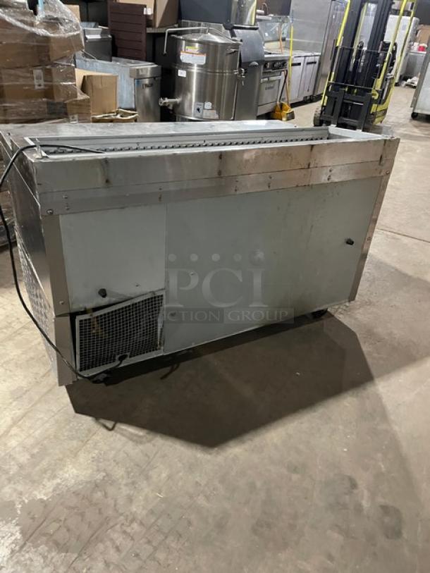 Continental stainless steel refrigerated prep table, single door, three drawers, poly coated wired rack, on casters, used condition.