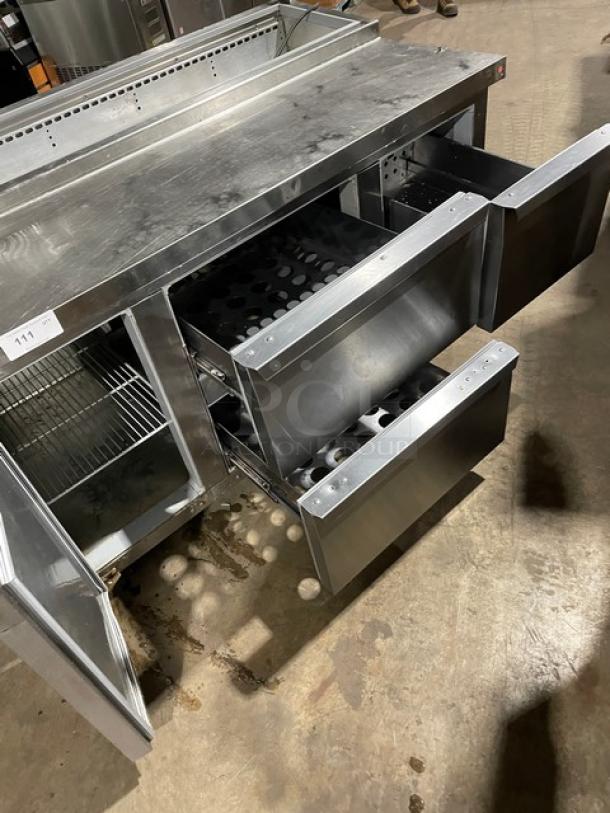 Continental commercial stainless steel refrigerated prep table, single door, 3 drawers, poly-coated rack, on casters.