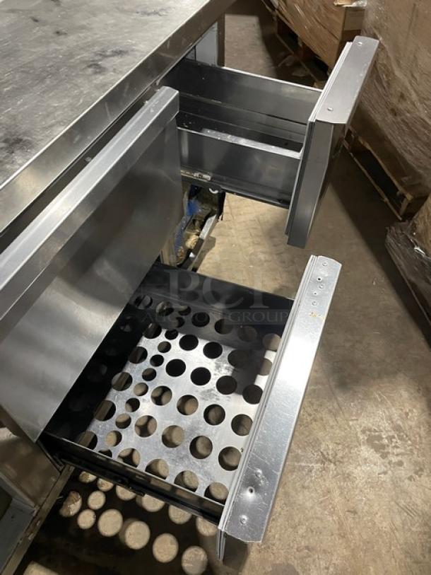 Continental stainless steel single door, 3-drawer refrigerated prep table with poly coated wired rack on casters.