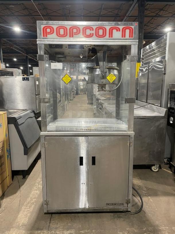 Gold Medal 2010TM stainless steel popcorn popper with single kettle, neon sign, electric cabinet style, in good condition.