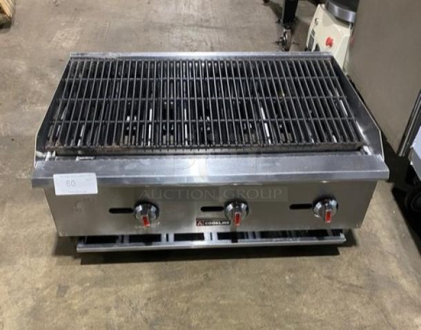 Cookline 60" stainless steel gas char broiler on legs, radiant design, three control knobs, used condition.